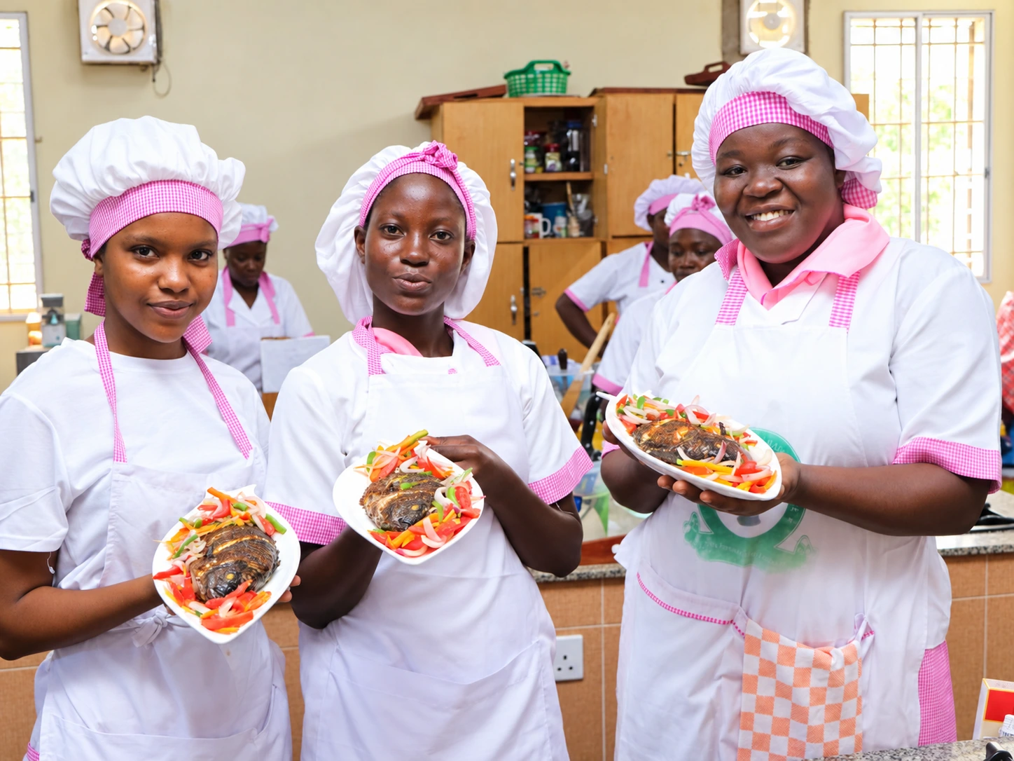Students presenting their finished dishes